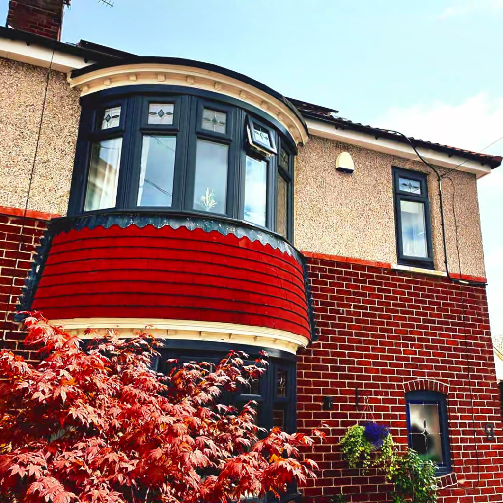 upper floor of house with black framed windows