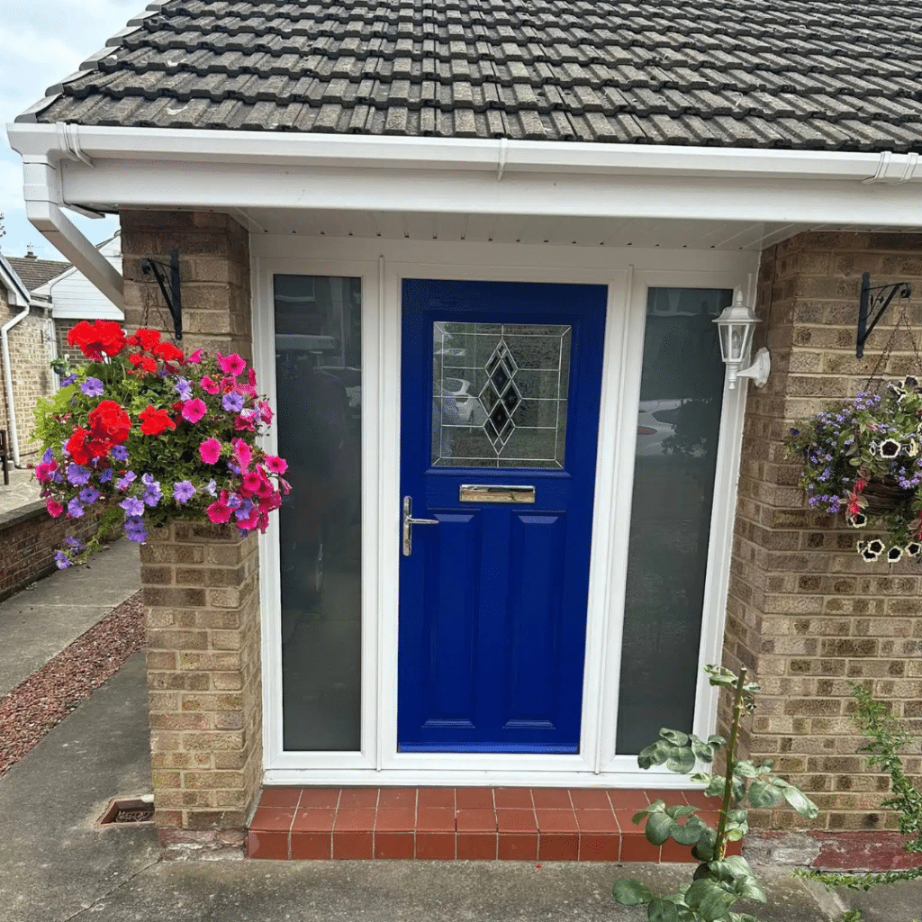 Blue composite door with large windows either side